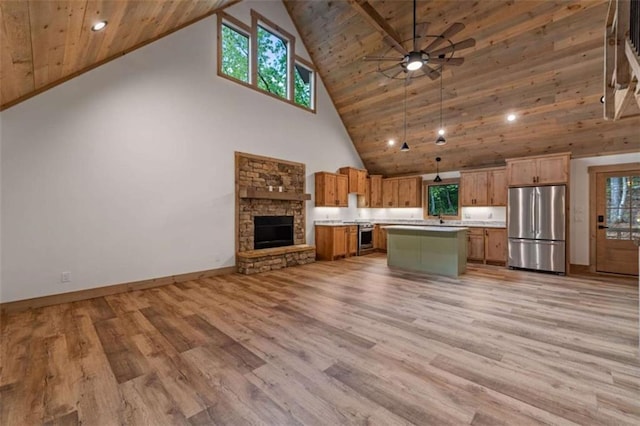 74 Cohutta Overlook Way, Blue Ridge, GA 30513 - kitchen featuring appliances with stainless steel finishes, open floor plan, high vaulted ceiling, light countertops, and a ceiling fan
