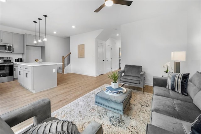 150 Chandler Trce, Covington, GA 30016 - living room featuring stairway, light wood-type flooring, ceiling fan, recessed lighting, and baseboards