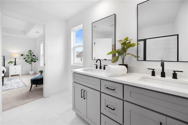 150 Chandler Trce, Covington, GA 30016 - bathroom with double vanity, marble finish floors, and baseboards