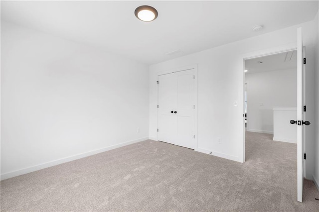 150 Chandler Trce, Covington, GA 30016 - unfurnished bedroom featuring carpet flooring, a closet, and baseboards