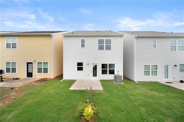 150 Chandler Trce, Covington, GA 30016 - back of property featuring a patio, central AC unit, and a lawn