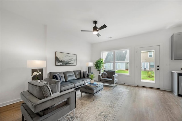 150 Chandler Trce, Covington, GA 30016 - living room featuring light wood-type flooring, a ceiling fan, and baseboards