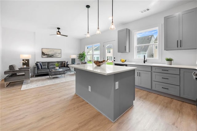 150 Chandler Trce, Covington, GA 30016 - kitchen featuring gray cabinetry, a sink, and light countertops