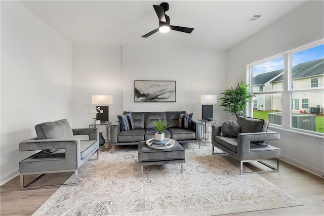 150 Chandler Trce, Covington, GA 30016 - living area with a ceiling fan, wood finished floors, and baseboards