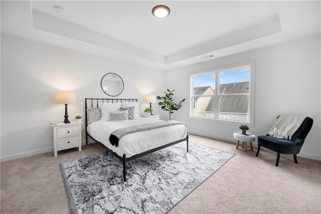 150 Chandler Trce, Covington, GA 30016 - bedroom featuring carpet flooring, a raised ceiling, and baseboards
