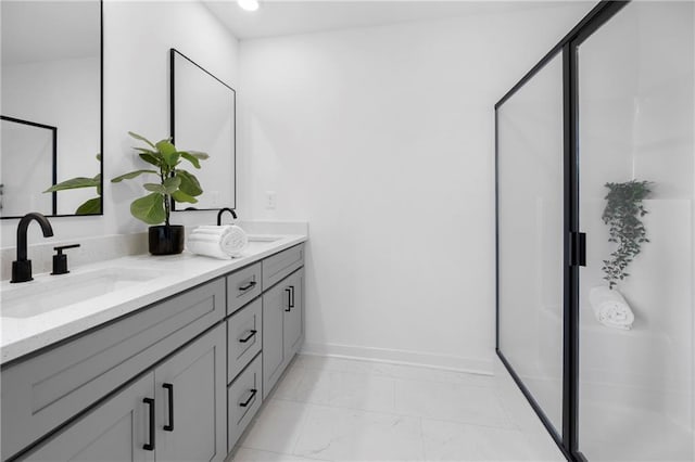 150 Chandler Trce, Covington, GA 30016 - full bathroom featuring marble finish flooring, double vanity, baseboards, a shower stall, and recessed lighting
