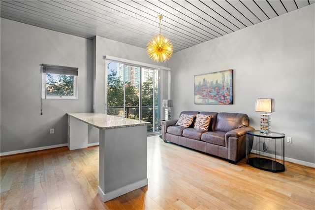 living room featuring wooden ceiling, a notable chandelier, and light hardwood / wood-style floors