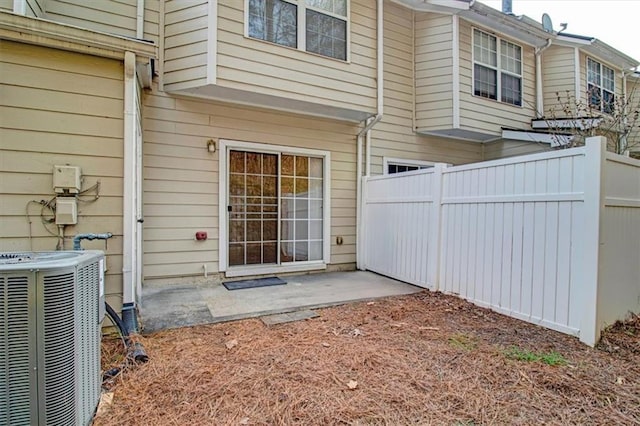 back of house featuring a patio, cooling unit, and fence