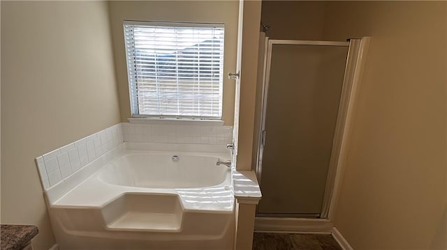 bathroom with shower with separate bathtub