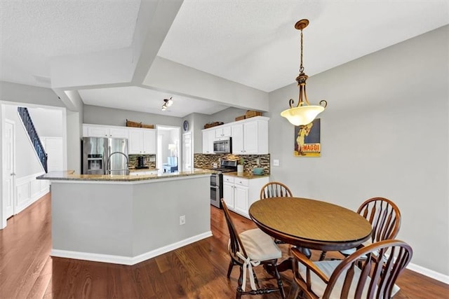 dining room featuring dark wood finished floors