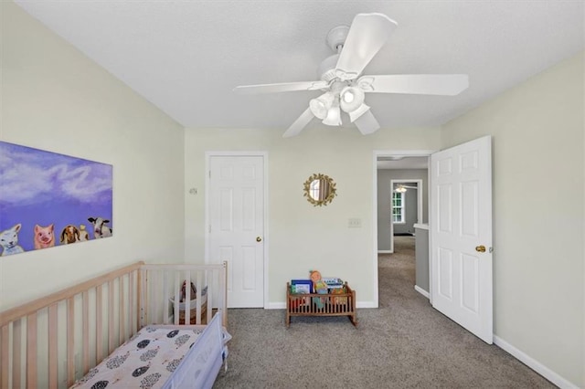 bedroom featuring baseboards, a ceiling fan, and carpet floors