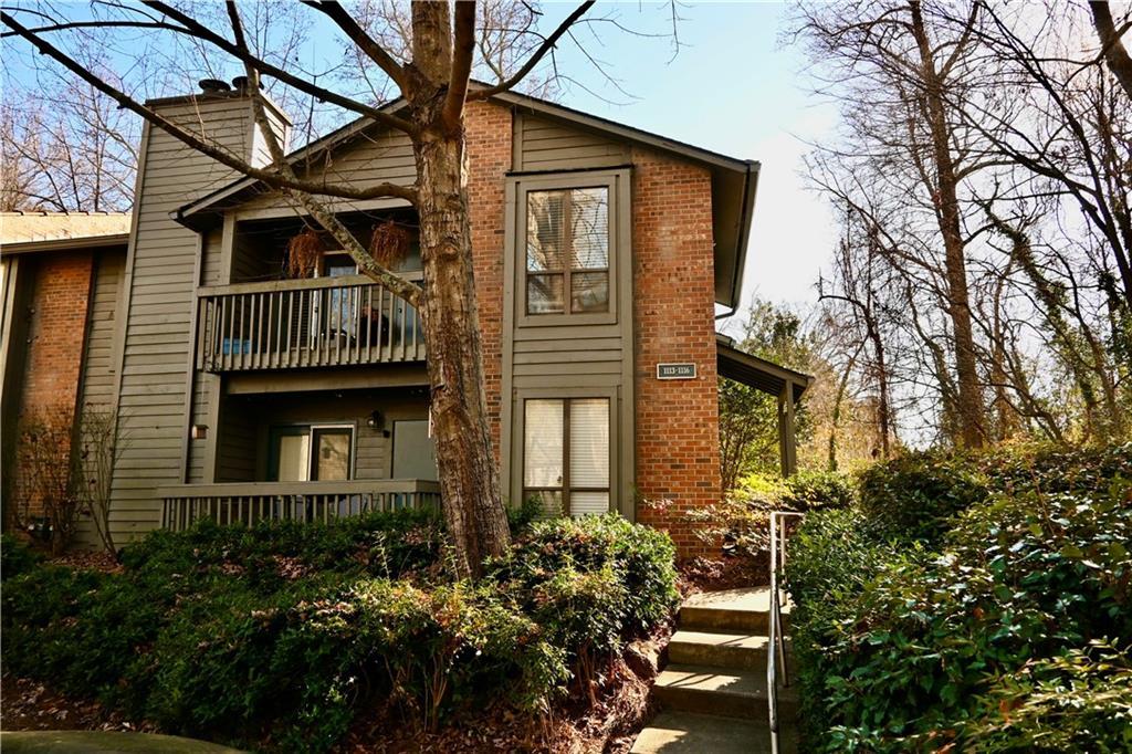 rear view of property with a balcony