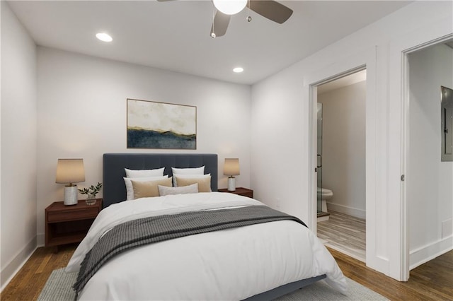 bedroom featuring wood finished floors, baseboards, ensuite bathroom, recessed lighting, and a ceiling fan