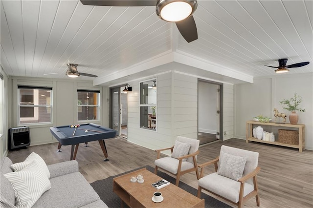 game room featuring ceiling fan, pool table, wood ceiling, heating unit, and wood finished floors