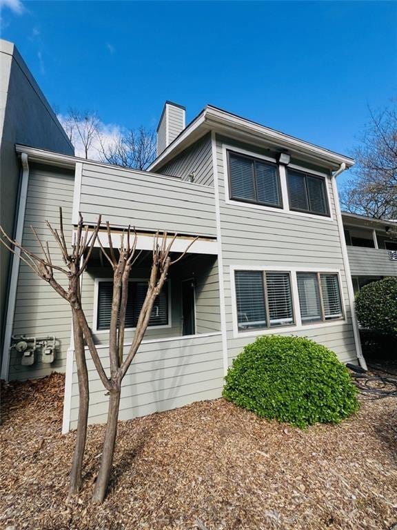 3432 Ivys Walk, Atlanta, GA 30340 - view of property exterior featuring a chimney