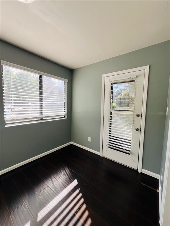 3432 Ivys Walk, Atlanta, GA 30340 - spare room featuring baseboards and dark wood-style flooring