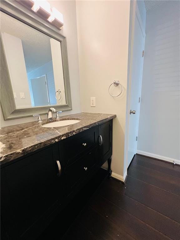3432 Ivys Walk, Atlanta, GA 30340 - bathroom featuring hardwood / wood-style floors, vanity, and baseboards