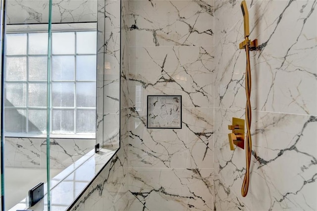 bathroom with a healthy amount of sunlight and a shower