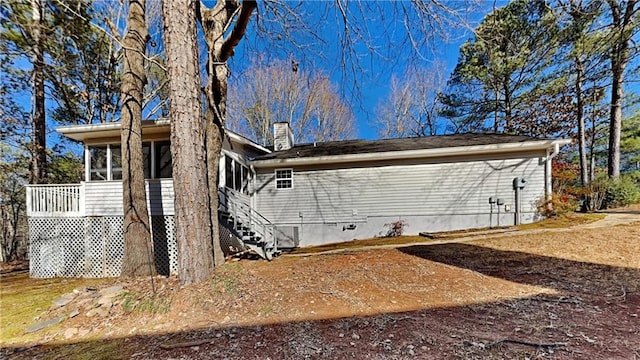 back of property featuring a sunroom