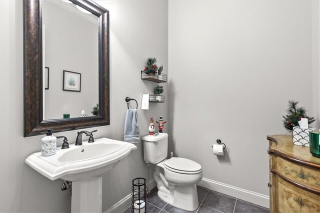 bathroom featuring toilet and tile patterned floors