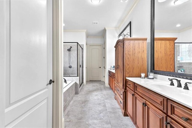 bathroom with tile patterned floors, vanity, crown molding, and plus walk in shower