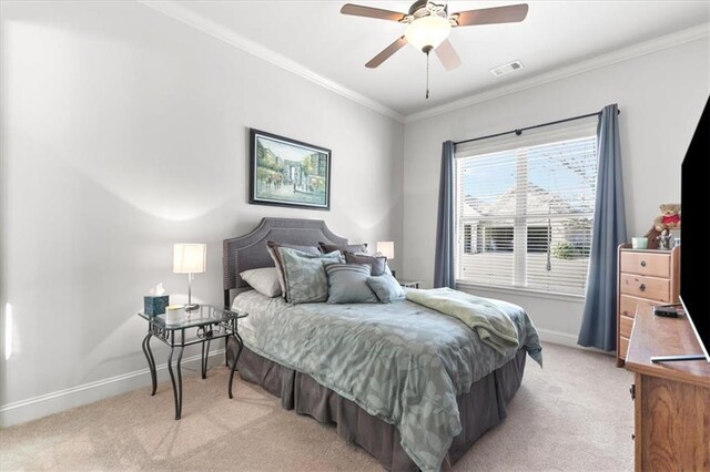 bedroom with ceiling fan, crown molding, and light carpet