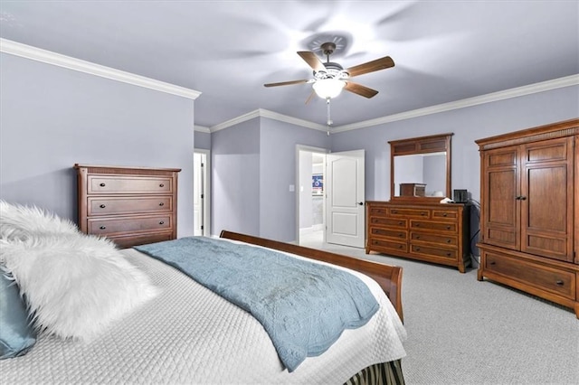 carpeted bedroom with ceiling fan and crown molding