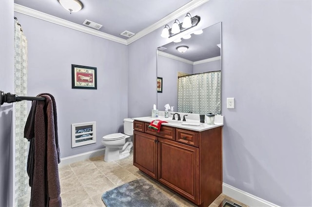 bathroom with vanity, toilet, and crown molding