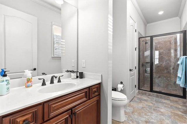 bathroom featuring crown molding, vanity, a shower with shower door, and toilet