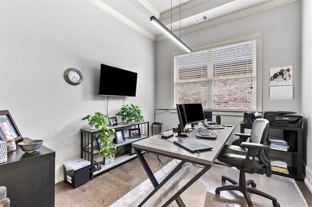 home office with hardwood / wood-style floors and crown molding