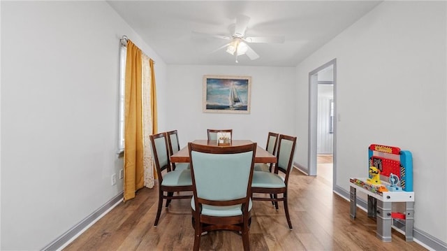 216 Coosawattee Ave SW, Rome, GA 30165 - dining room with wood finished floors, a ceiling fan, and baseboards