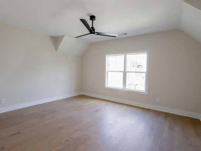 1415 Coretta Bnd, Atlanta, GA 30318 - additional living space with lofted ceiling, ceiling fan, wood finished floors, and baseboards