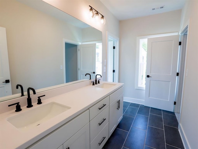 1415 Coretta Bnd, Atlanta, GA 30318 - full bathroom featuring baseboards, double vanity, and tile patterned floors