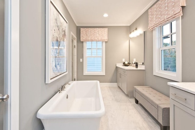 full bathroom featuring crown molding, vanity, a soaking tub, and marble finish floor