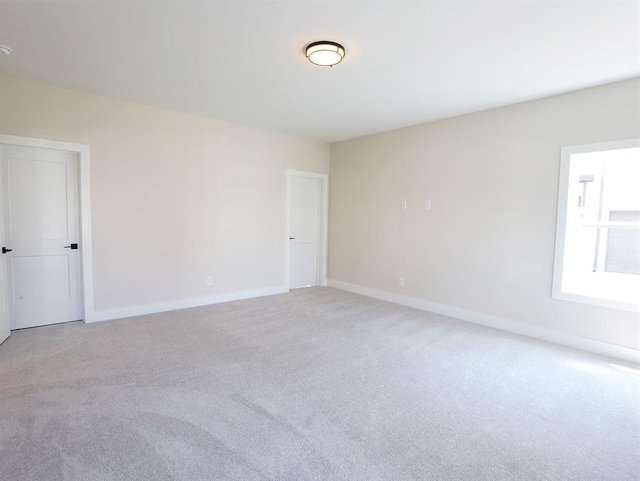1415 Coretta Bnd, Atlanta, GA 30318 - spare room featuring light colored carpet and baseboards