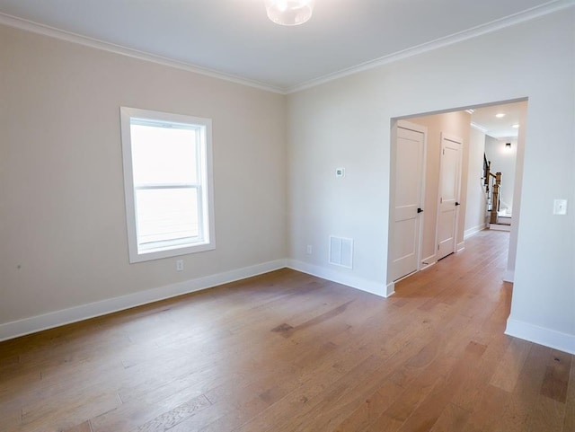 1415 Coretta Bnd, Atlanta, GA 30318 - unfurnished room featuring ornamental molding, light wood-style flooring, and baseboards