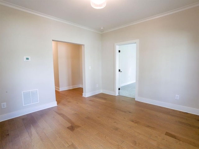 1415 Coretta Bnd, Atlanta, GA 30318 - spare room with light wood-type flooring, crown molding, and baseboards