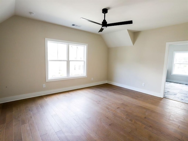 1415 Coretta Bnd, Atlanta, GA 30318 - bonus room featuring ceiling fan, lofted ceiling, wood finished floors, and baseboards