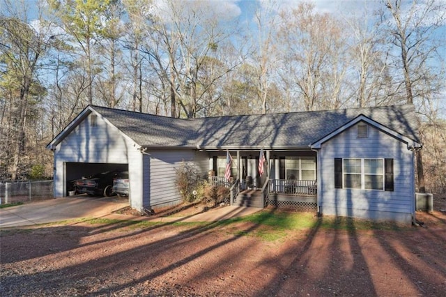 ranch-style house featuring a garage, dirt driveway, a porch, and central AC