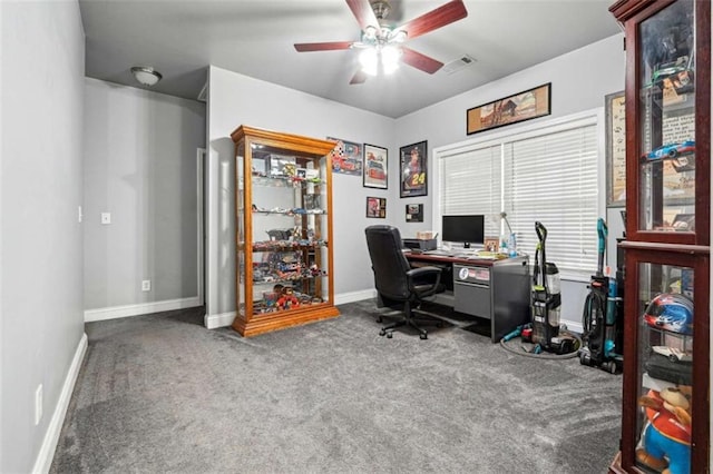 office space with carpet floors, baseboards, visible vents, and a ceiling fan