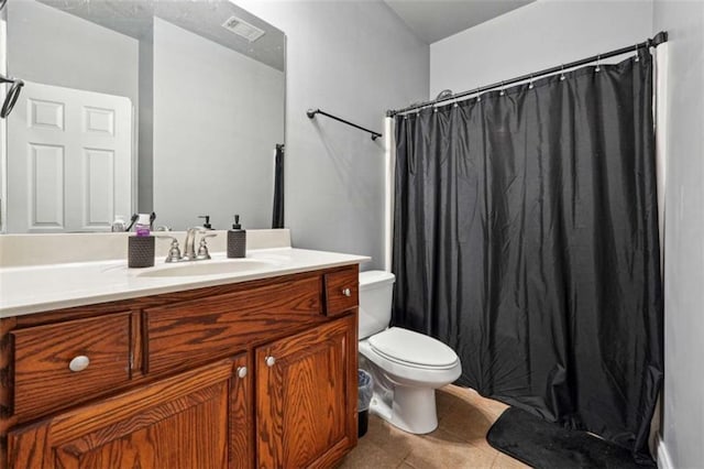 bathroom featuring curtained shower, toilet, visible vents, vanity, and tile patterned floors