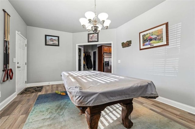 recreation room with billiards, baseboards, and wood finished floors