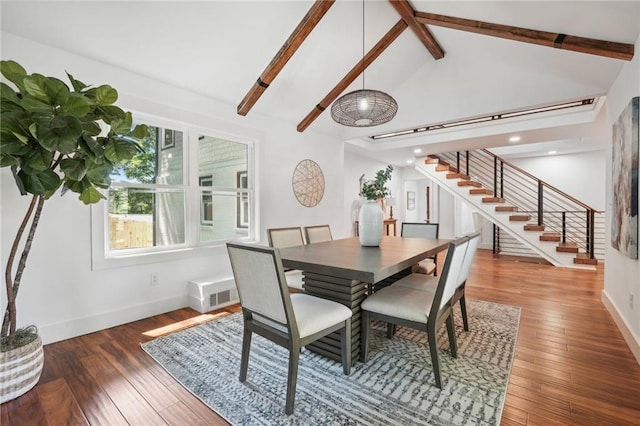 dining room featuring stairway, baseboards, beamed ceiling, and hardwood / wood-style flooring