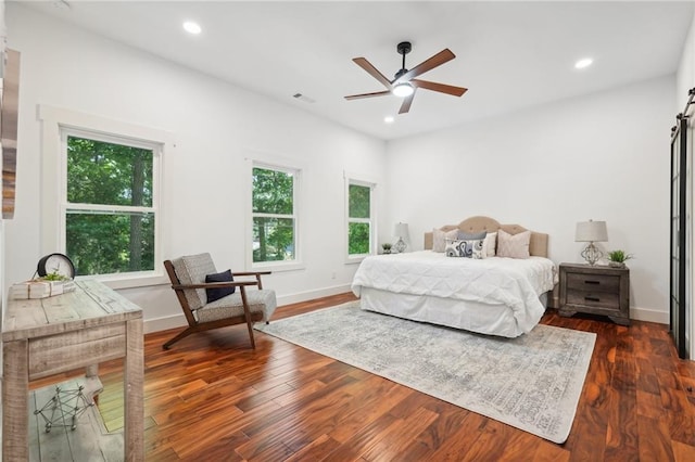 bedroom with recessed lighting and dark wood-style floors