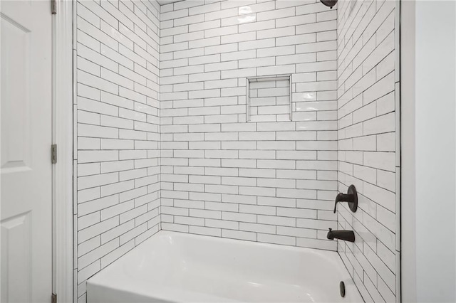 bathroom with washtub / shower combination