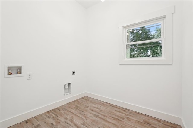 laundry room featuring electric dryer hookup, light wood-style flooring, baseboards, hookup for a washing machine, and laundry area