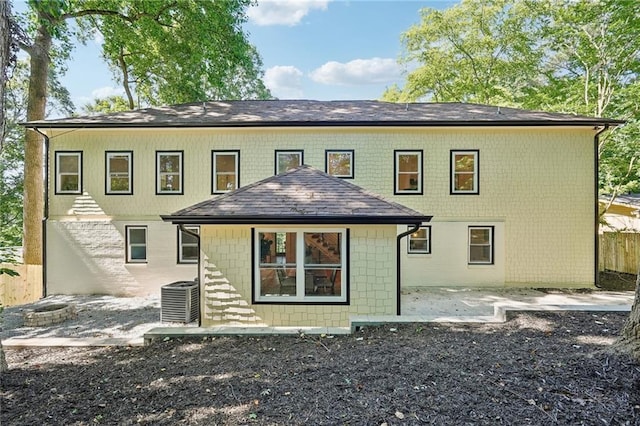 back of property with a patio area, cooling unit, and fence