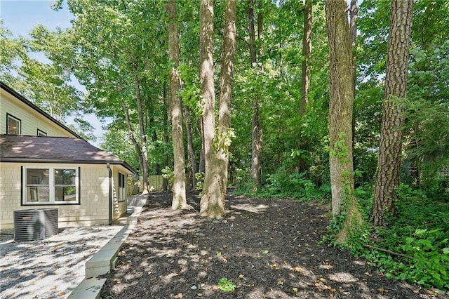 view of yard with central AC unit