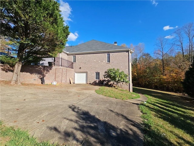 back of property featuring a garage