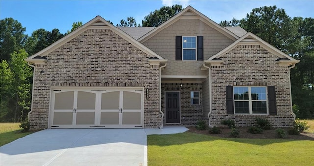 view of front of house with brick siding, driveway, and a front lawn